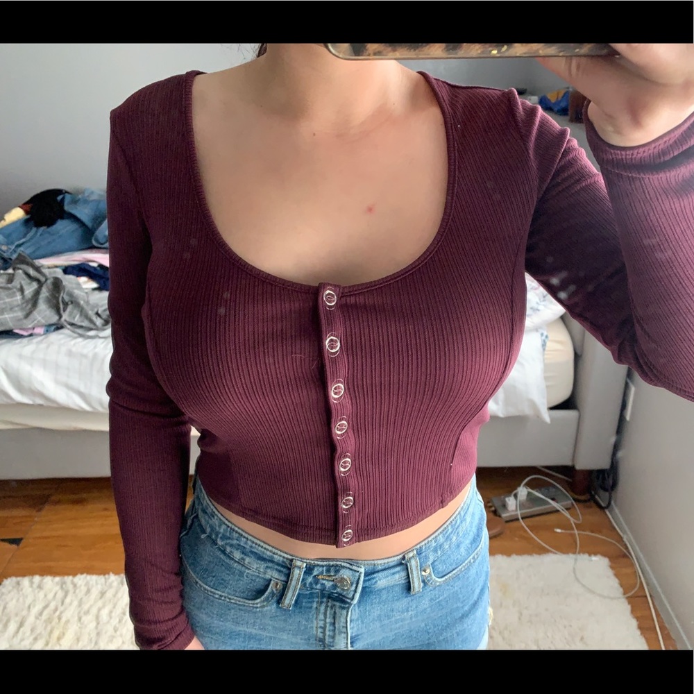 Button up long sleeve burgundy top .